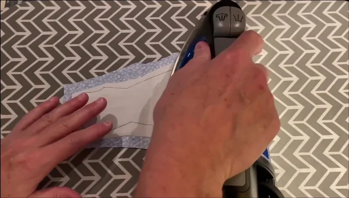 Prepare the Fabric: Iron the fabric adhesive to the wrong side of fabric scraps (approx. 5x8.5 inches).