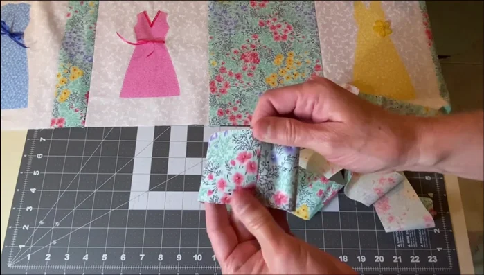 Attach Side Borders: Sew two long strips together if necessary. Sew one strip to one side of the table runner panel, then the other strip to the remaining side. Press seams towards the outside.