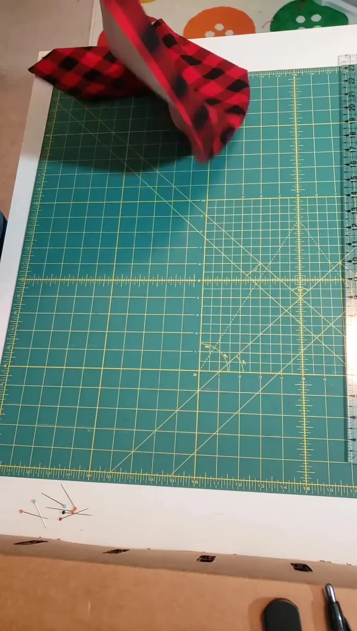 Fold the flannel fabric in half lengthwise (hot dog style), matching the raw edges. Pin to hold.