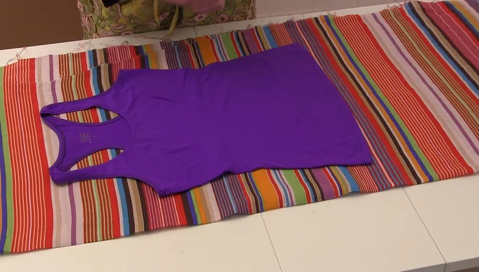 Cut out the back and front pieces of the garment. Remember to only cut one layer for the front initially.