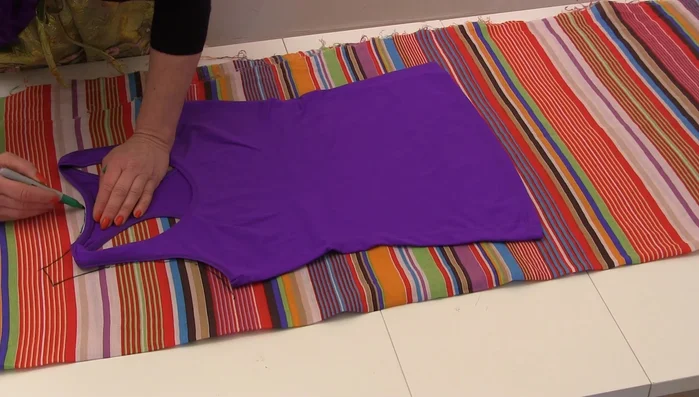 Cut out the back and front pieces of the garment. Remember to only cut one layer for the front initially.