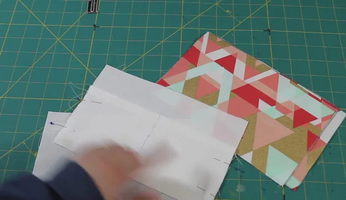 Attach the zipper: Attach the zipper to the outer fabric pieces, then attach the lining pieces to the outer pieces, leaving a gap on one side of the lining.