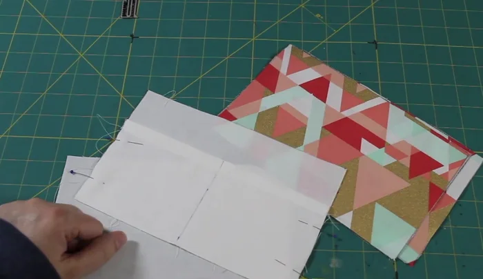 Attach the zipper: Attach the zipper to the outer fabric pieces, then attach the lining pieces to the outer pieces, leaving a gap on one side of the lining.