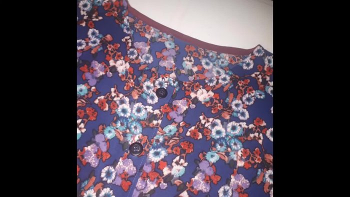 Prepare fabric: Add seam allowances (1 inch for shoulder, 2.5 inches for button placket).