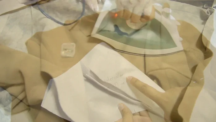 Attach the top collar to the neckline.