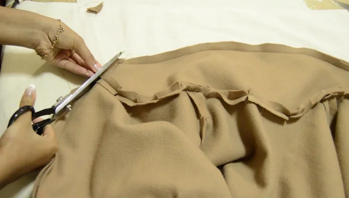 Trim excess fabric from the facing.