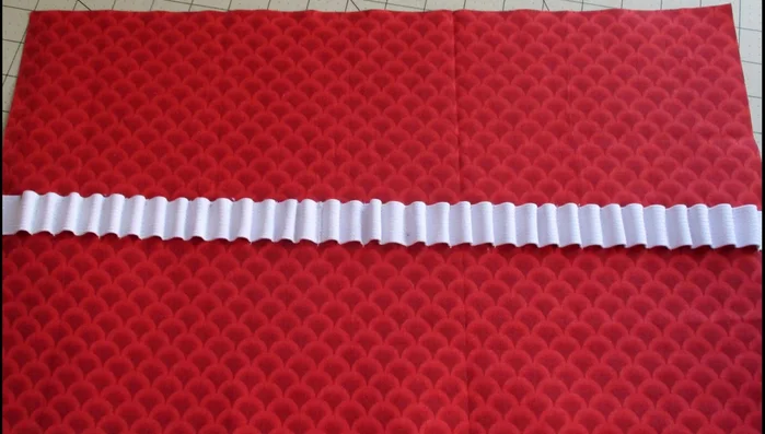 Attach elastic loop to the top edge of the stitched elastic.
