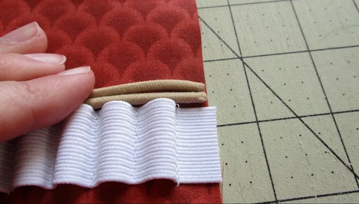 Attach elastic loop to the top edge of the stitched elastic.