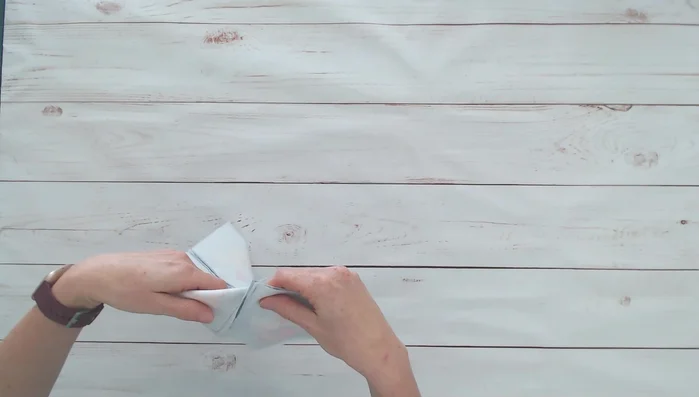 Sew two adjacent sides of the cube together, leaving a 1.5-inch gap on the final side for turning.