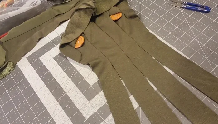 Attach tentacles to body: Attach the tentacles to the body panels by sewing along the edge, one side at a time.