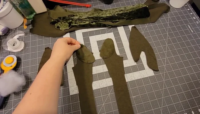 Prepare the eye panels: Sew the bottom eye panel to the eyelid piece, stuffing a little polyfill inside. Then attach the top eye panel to the bottom one.