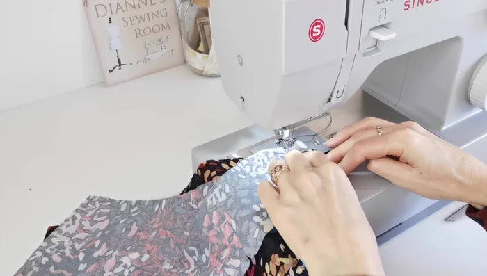 Attach Neck Facing: Pin the outer and facing pieces right sides together, stitch around the neckline, leaving a slit at the front for opening. Understitch around the neckline.