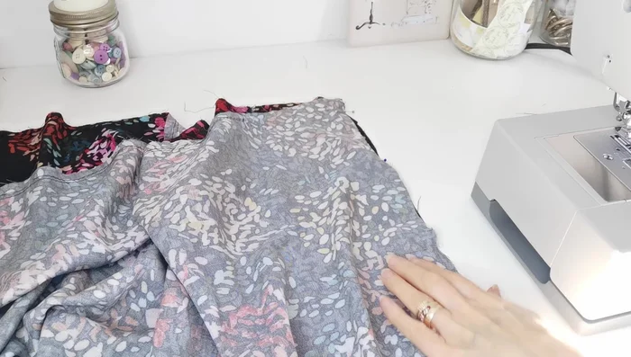 Attach Bottom Panels: Sew the side seams of the lower panels together. Then, pin and sew the bottom panels to the top bodice, matching notches and center points, pulling gathering stitches evenly.