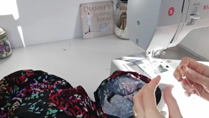 Insert Elastic into Sleeves: Measure and thread elastic through the sleeve openings, joining the ends and stitching securely. Close the opening.