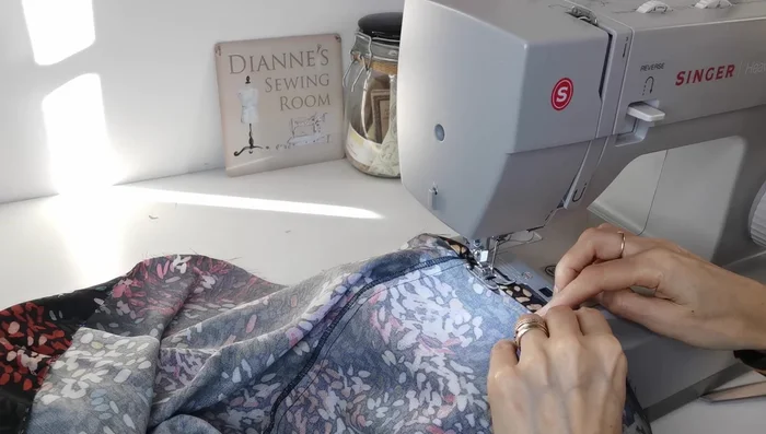 Hem Top: Create a narrow hem on the top of the tunic.