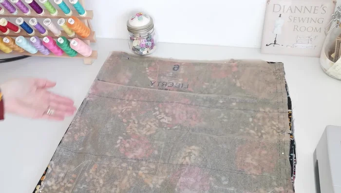 Cut Pattern Pieces: Cut two pieces each of the lower front, lower back, sleeve, upper back, and upper front pieces, following the pattern instructions and noting notches.