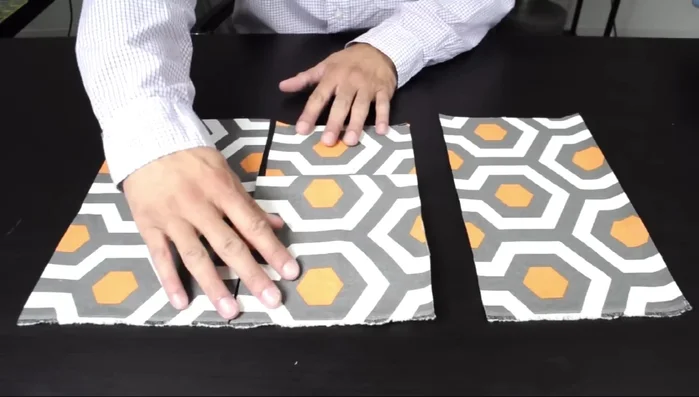 Assemble the front panel: Fold the 6 1/2 x 21 inch piece into a trifold to form a Z shape. Sew one side, then the other. Fuse interfacing to the back.