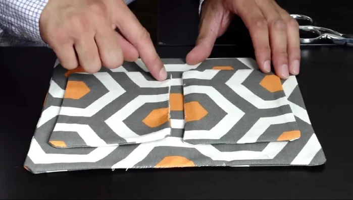 Construct the larger inside pocket: Sew the 11 x 8 1/2 inch piece to the back inside body piece.