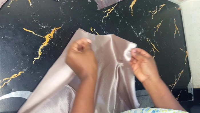 Add interfacing to the facing for stability. Attach the facing to the skirt’s waistline, sew, and then flip it to create a clean finish.