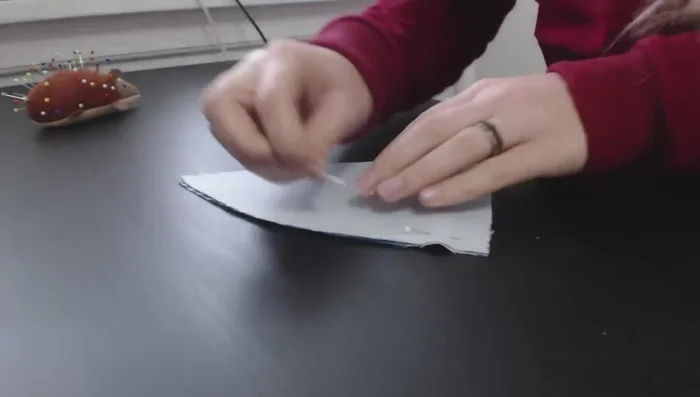 Attach the back panel to the cap halves, repeating the pressing and topstitching steps.