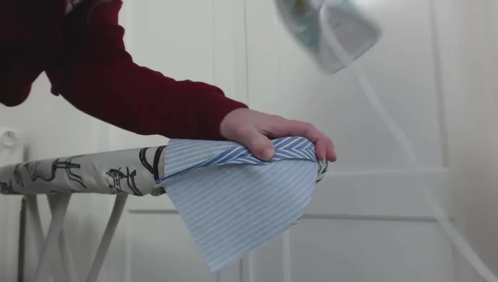 Attach the back panel to the cap halves, repeating the pressing and topstitching steps.