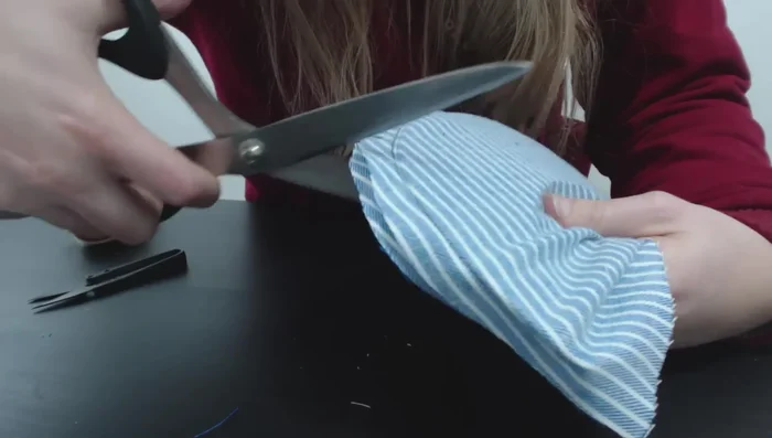 Sew the brim to the front of the cap, using a zipper foot for precision.