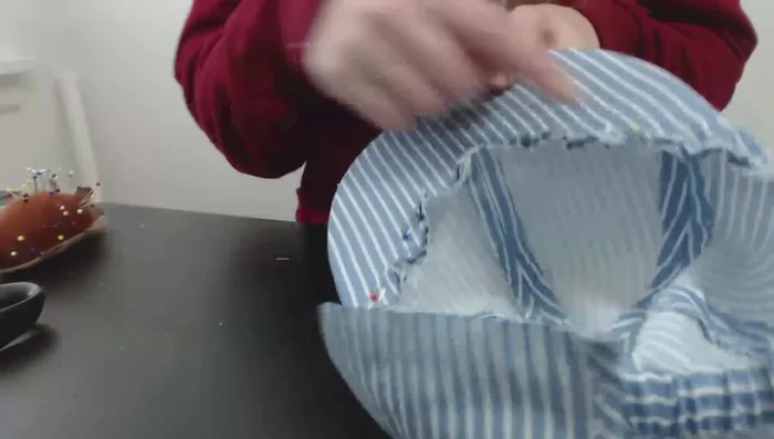 Sew the brim to the front of the cap, using a zipper foot for precision.