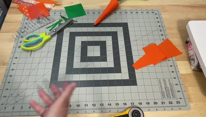 Sew carrot pieces: Place the two carrot pieces right sides together and stitch down one side and across the bottom, leaving the top open for turning and stuffing.