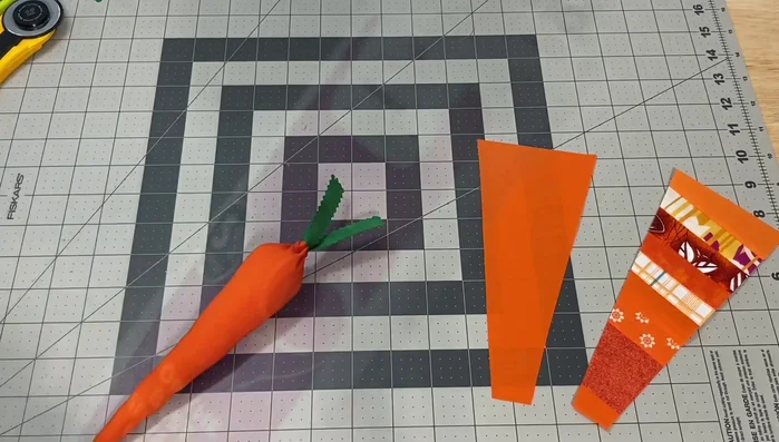 Make leaves: Cut squares of green fabric. Fuse two pieces together using Heat n Bond fusible interfacing. Cut leaves using pinking shears or rotary cutter.