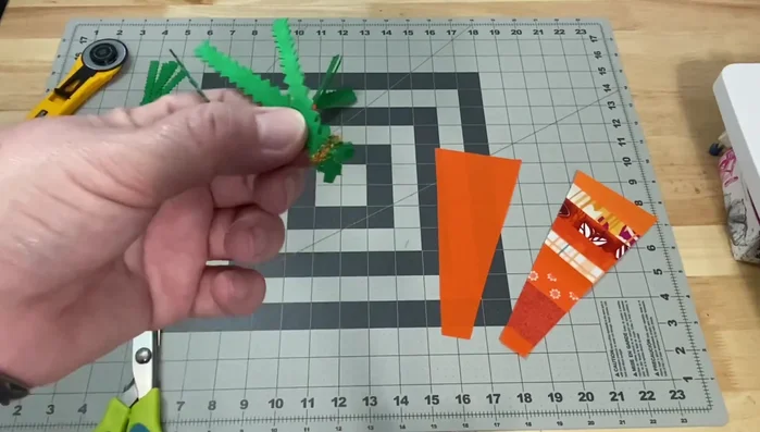 Assemble leaves: Stitch several leaves together to create leaf clusters.