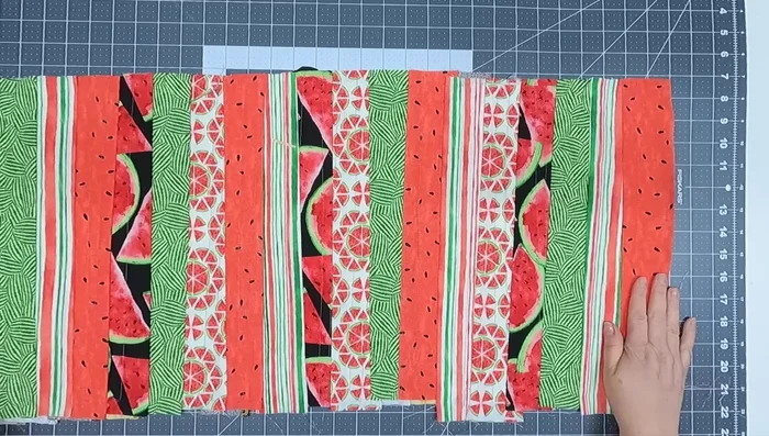 Trim the edges: Use a rotary cutter and mat (or scissors) to trim the edges, ensuring all sides are straight. Use a ruler to make it even. Trim close to the edges while ensuring you don't cut off too much of the batting.