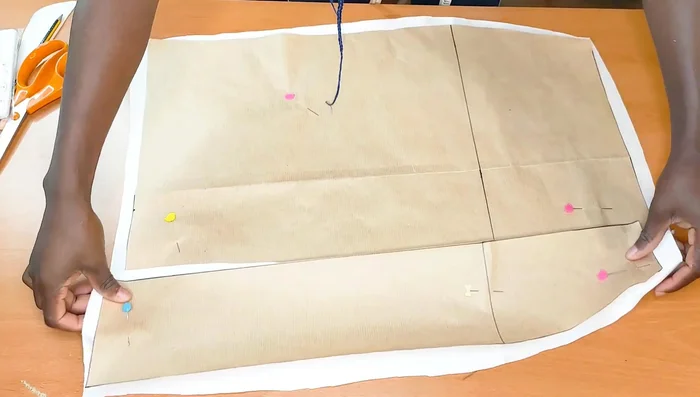 Join the back piece. Pin and stitch the side seams of the dress.