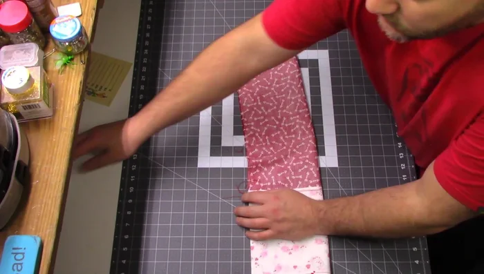 Sew the sides and bottom: Fold the fabric right sides together, matching seams, and pin. Sew a 1/4" seam down the sides, pivoting at the corners to sew the bottom.