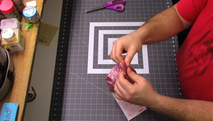 Box the corners: Fold the bottom seam to the side seam, measure and draw a 1" line from the corner, and sew along the line. Repeat on the opposite corner.