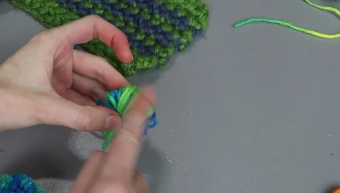 Create a chain using the long tail and crochet hook (or another method if not familiar with crochet).