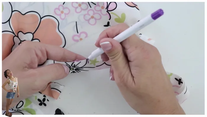 Trim and finish neckline: Trim the excess bias binding to about 3mm. Fold over and topstitch the bias binding to the neckline, resulting in a single stitching line.