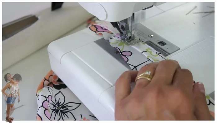 Trim and finish neckline: Trim the excess bias binding to about 3mm. Fold over and topstitch the bias binding to the neckline, resulting in a single stitching line.