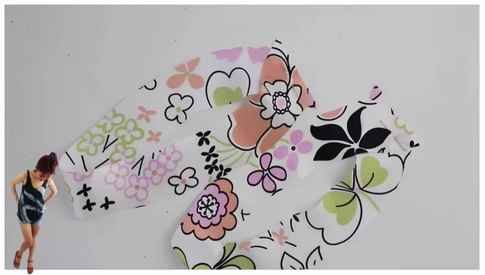 Finish armholes: Sew together the armhole bias binding, iron the seam apart, trim, and press. Attach to the armhole, ensuring the presser foot sits directly on the edge. Use the same techniques as the neckline (e.g., slightly pulling to the left when rounding curves).