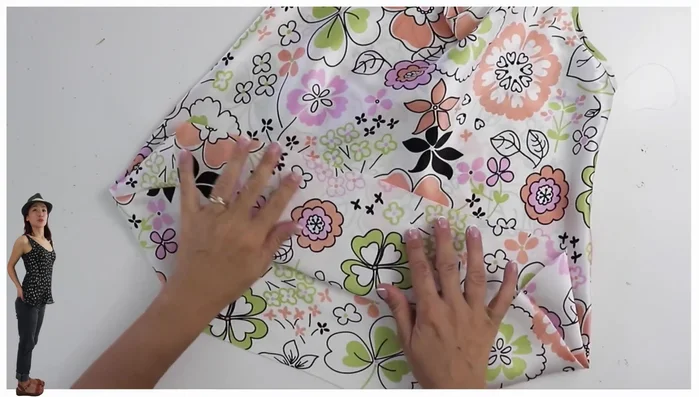 Hem the top: Serge the hem, steam it to remove waviness, fold up the hem, and stitch along the serged line.