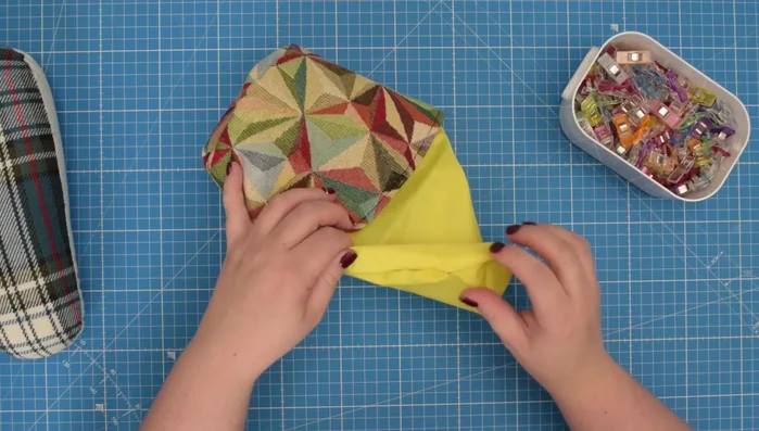 Insert the lining into the cover. Press and finish.