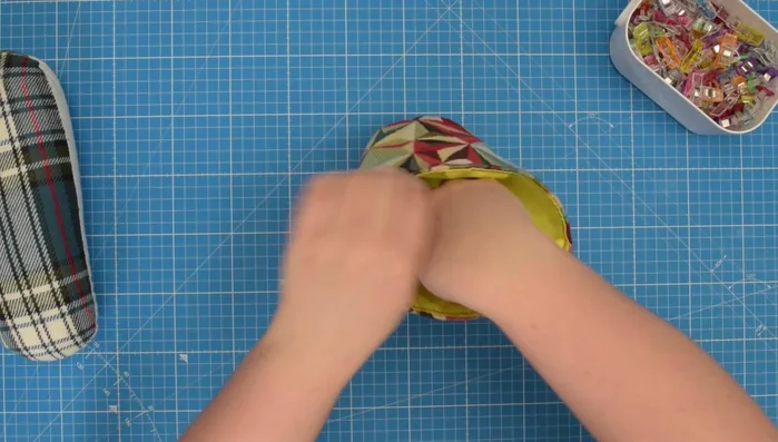 Insert the lining into the cover. Press and finish.