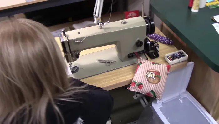 Fold the binding at a 45° angle, aligning raw edges. Finger press and fold down, ensuring the fold and raw edge are on the same line. 