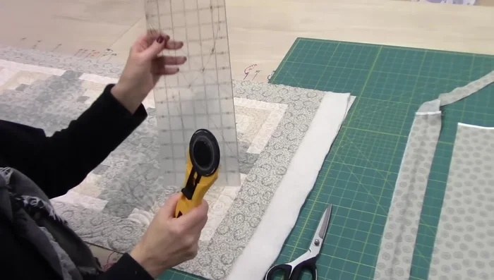 Trim excess batting and backing from your quilt.