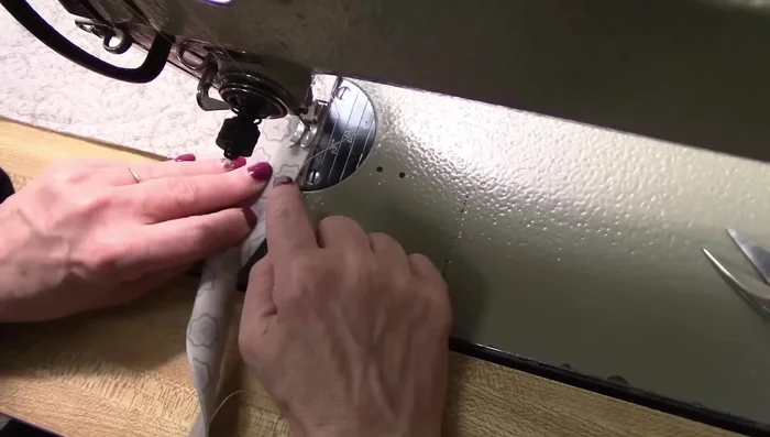 For the final stitching, slow down as you approach the edge, marking 1/4 inch from the edge. Repeat corner folding and stitching techniques.