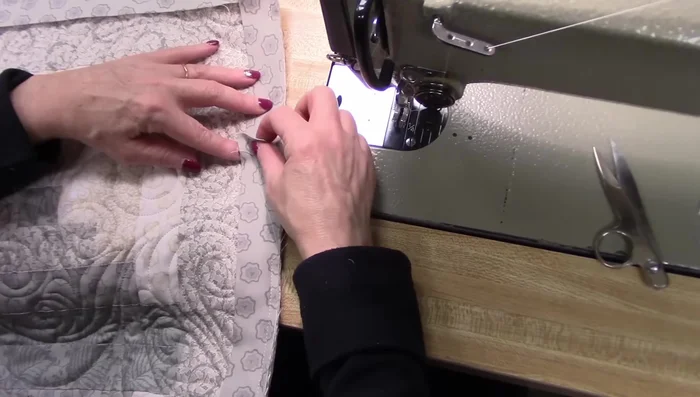 Overlapping the ends of the binding by about 1/2 inch, sew the ends together using a small seam allowance. Open and press the seam.