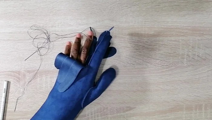 Adjust finger tips: Check the glove fit for each finger, trim excess material on the front pieces to match the back, and re-sew.