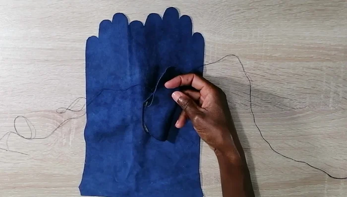 Sew the sides of the trunk piece together, leaving the thumb opening.