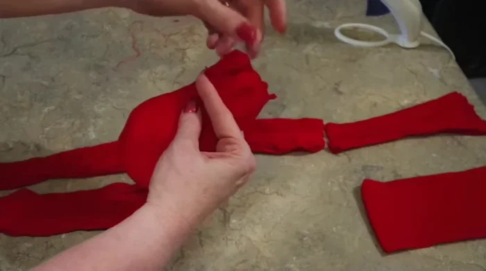 Trim excess fabric from the top of the sack.