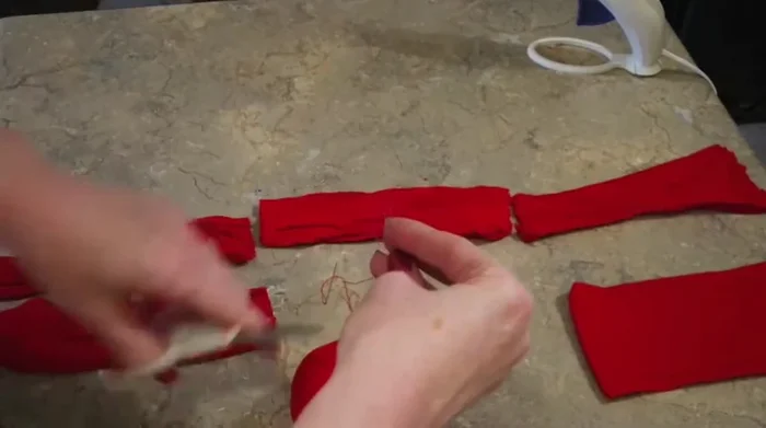 Shape and adjust the apple, squeezing and molding it into a desired shape.