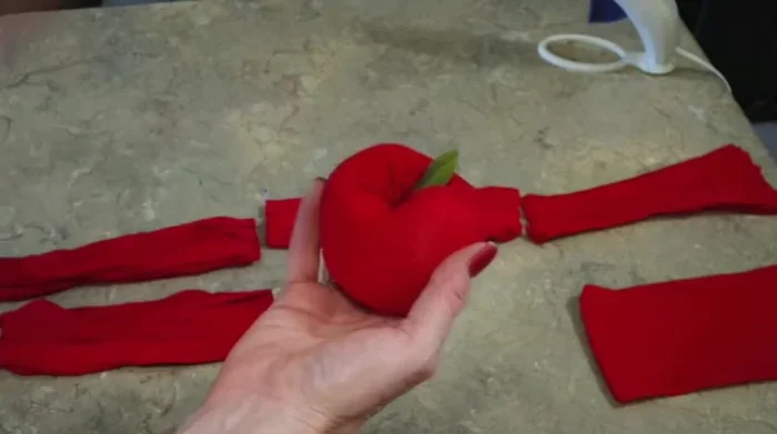 Optional: Attach fake leaves and/or a stem using hot glue.